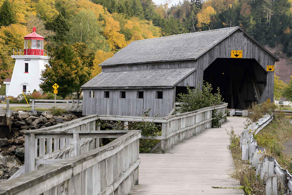historic covered wood bridges in a rural landscape