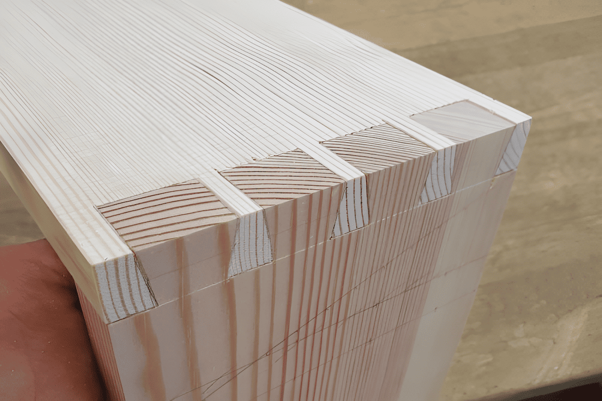 close up of dovetail joint in solid wood door frame