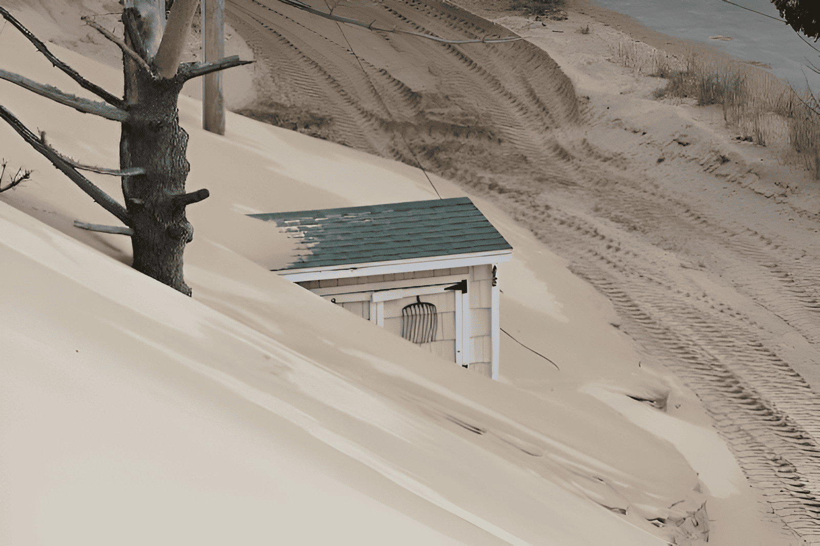 sand dunes encroaching on buildings and infrastructure