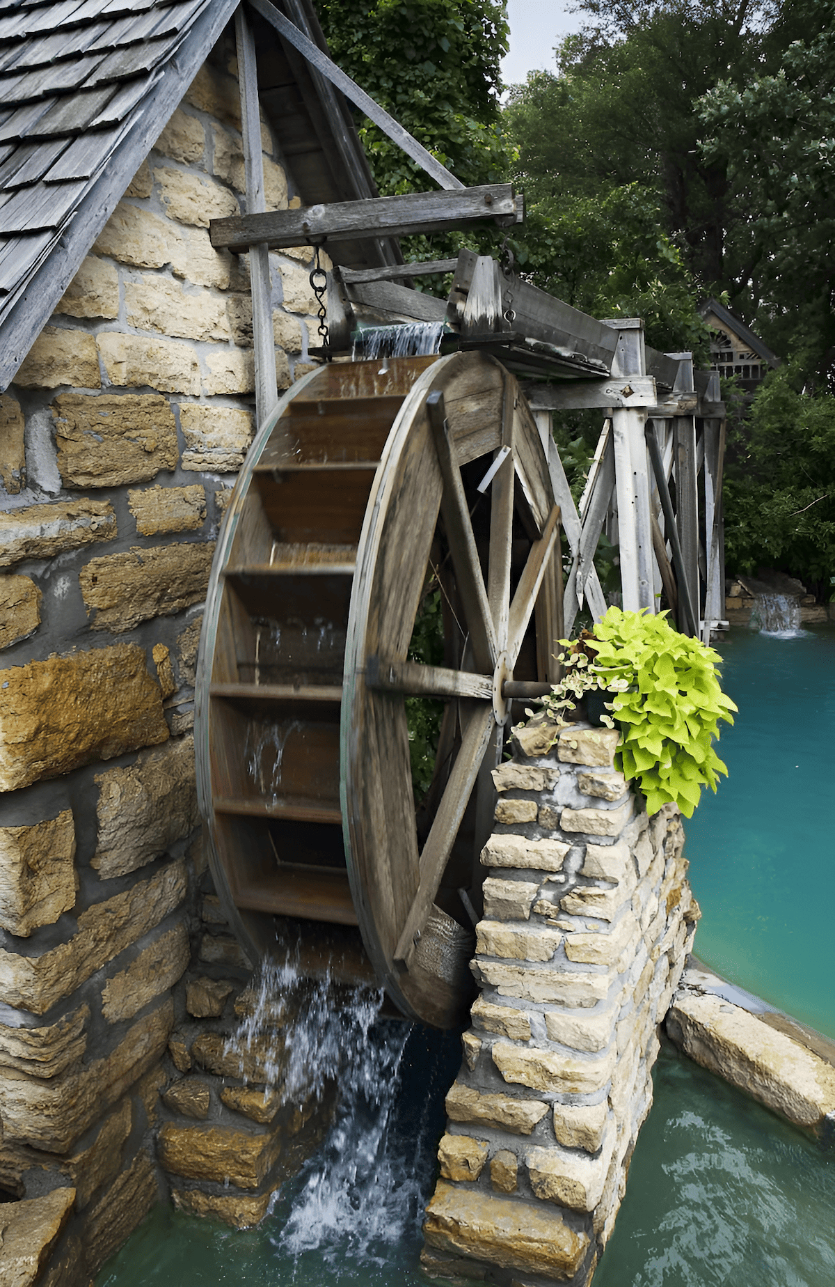 historic wood water wheel powering a flour mill
