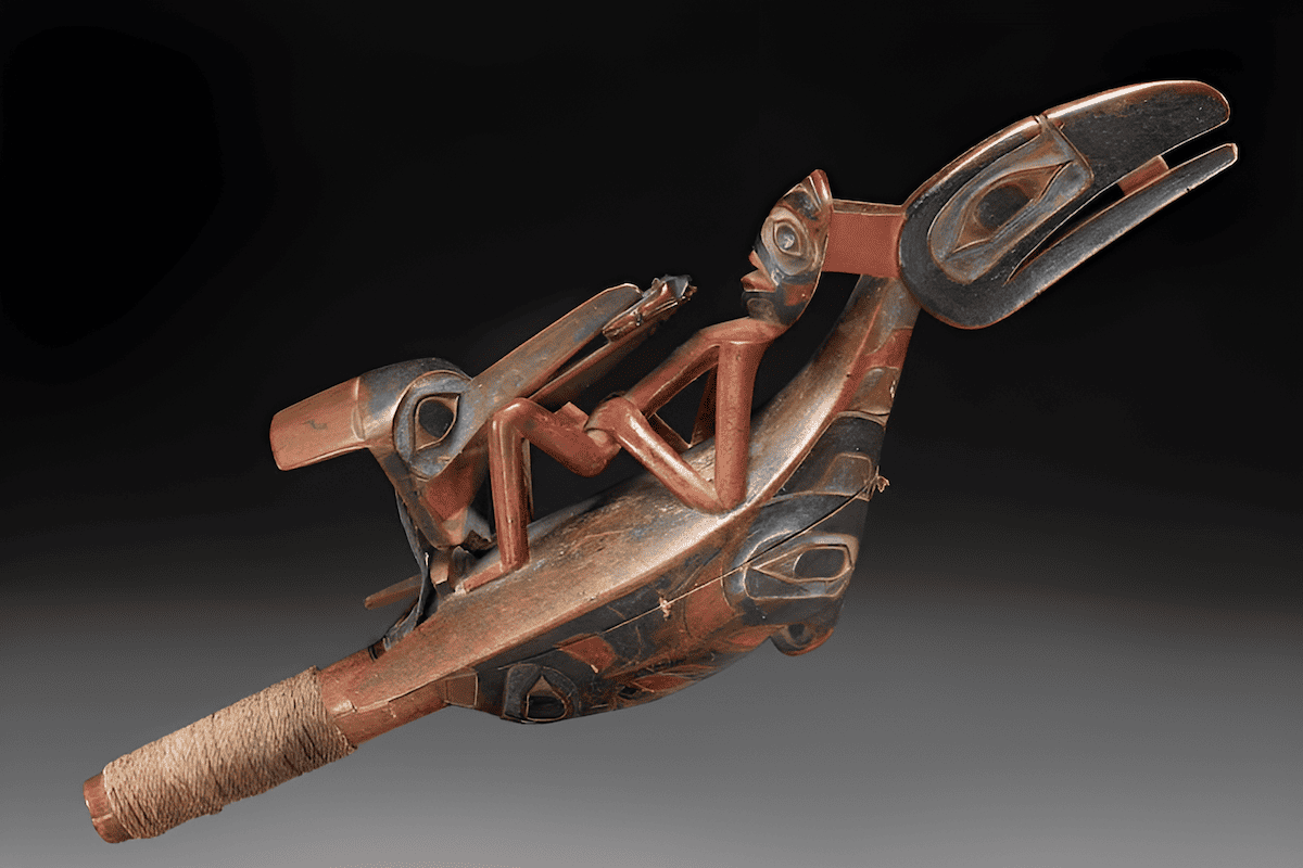 Indigenous Pacific yew wood carving of a man in a canoe