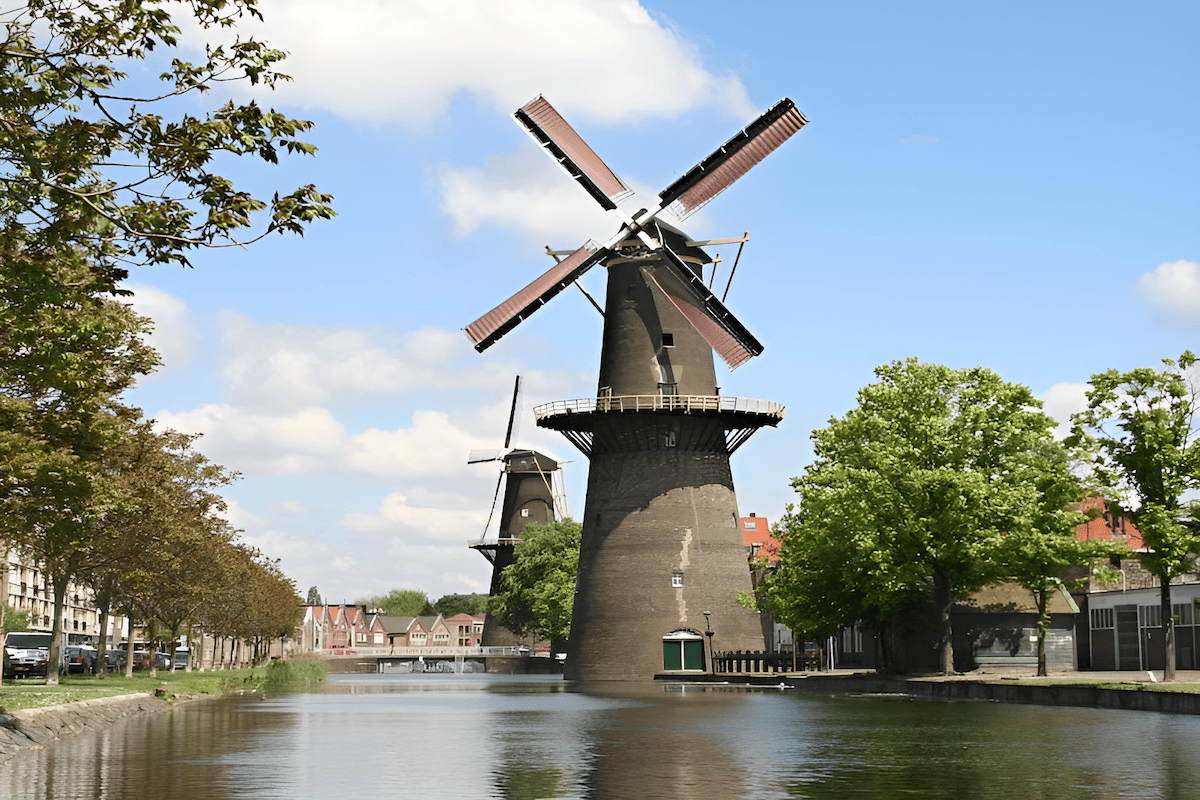 famous Dutch wooden windmill in the countryside