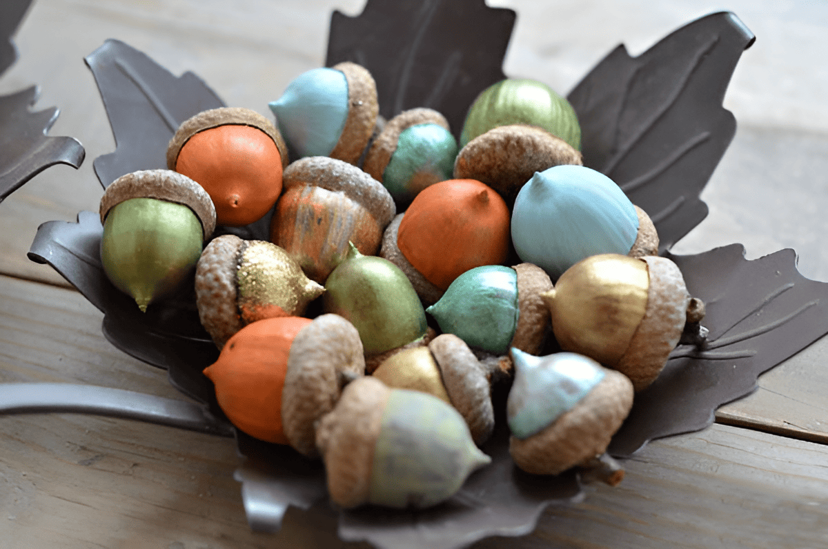 bowl of painted acorns from a red oak tree used in seasonal decor