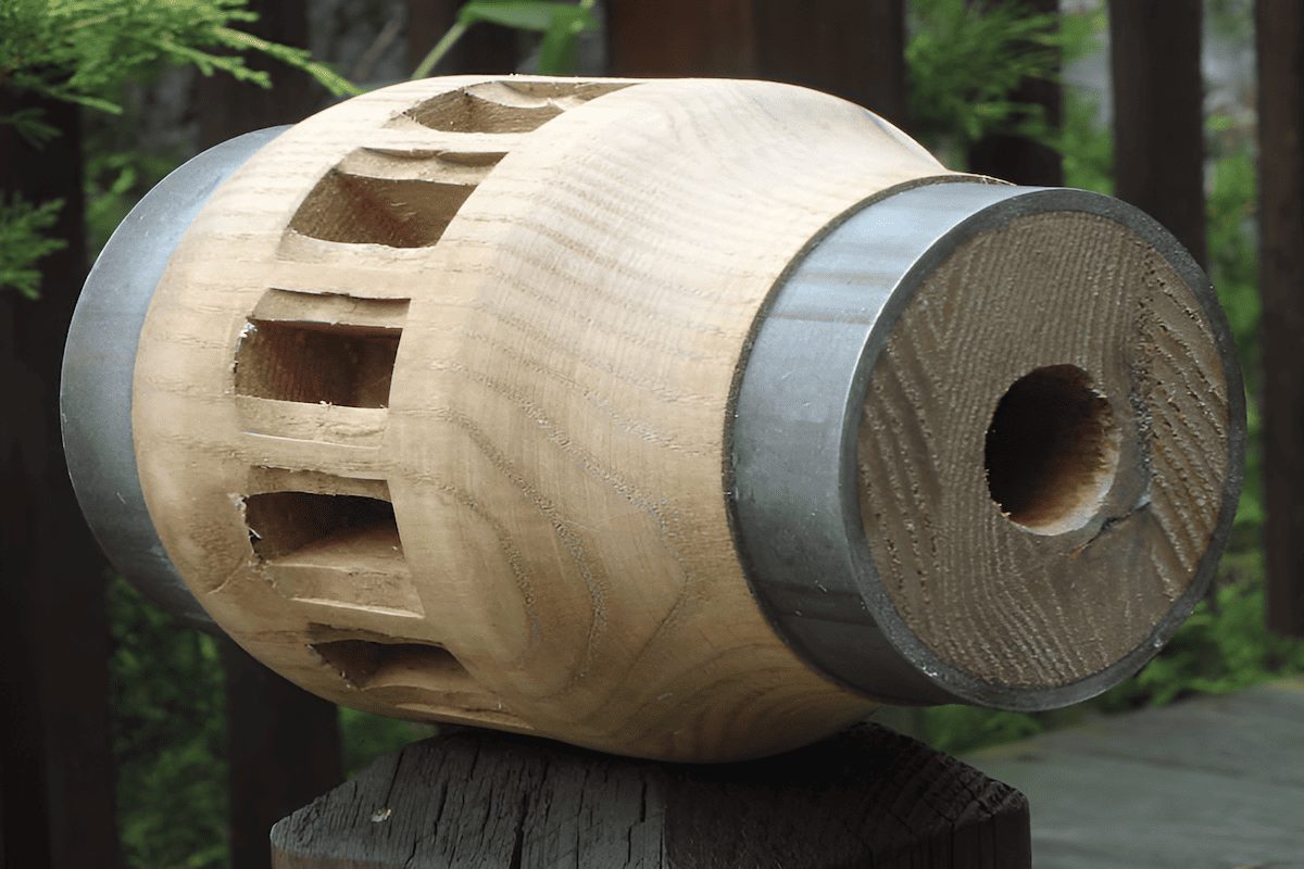 the hub of a wood wagon wheel showing spoke mortises