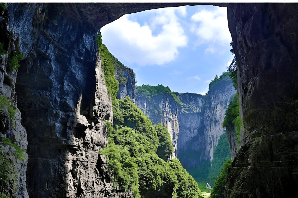 towering sandstone pillars rising from forested sinkholes in Zhangjiajie, China